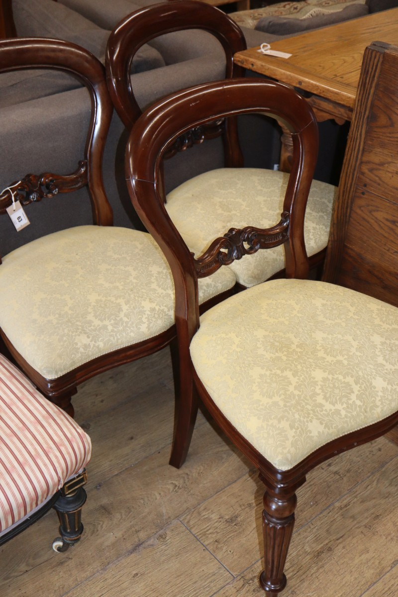 A set of six Victorian style mahogany balloon back dining chairs